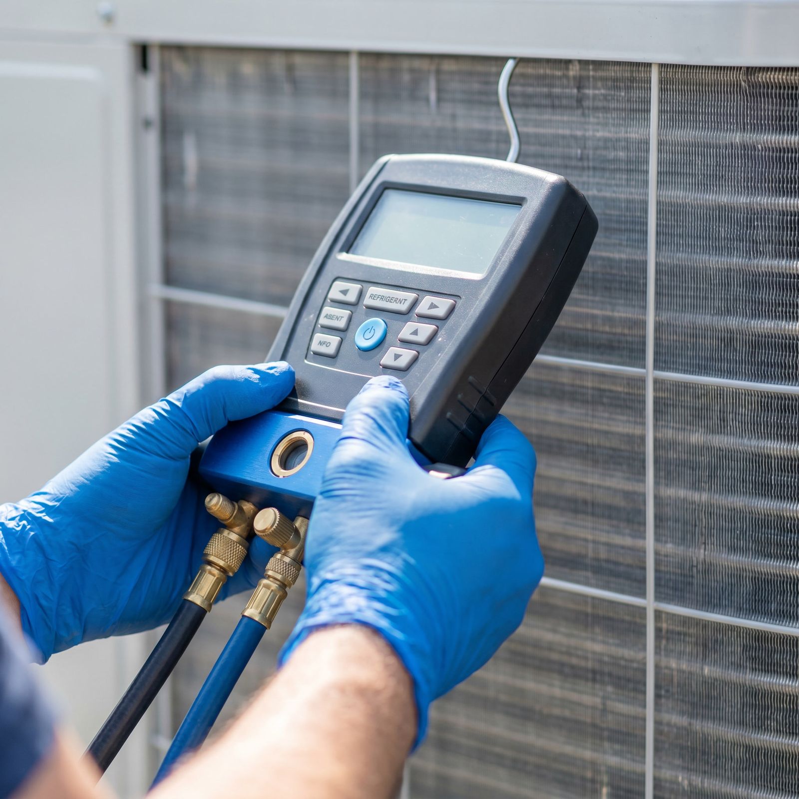 HVAC technician repairing an air conditioning system